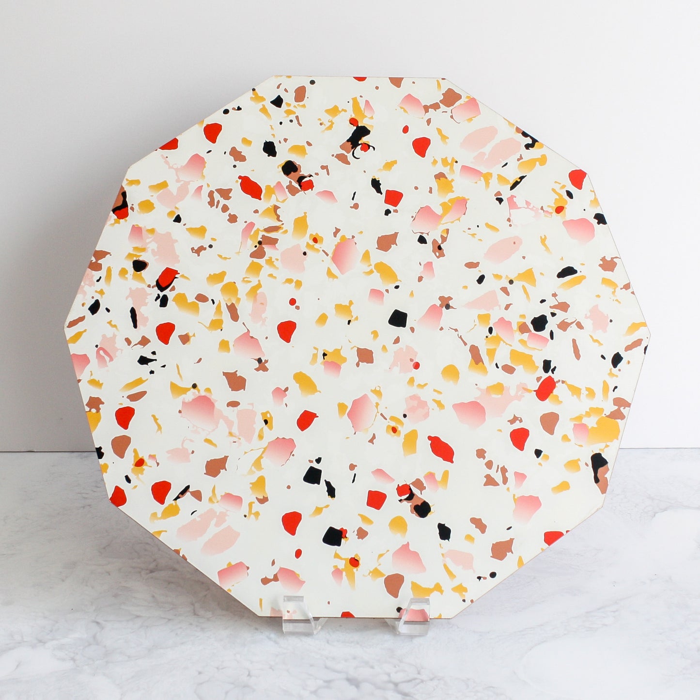 Terrazzo placemats in coral made of cork and wood by Tisch New York